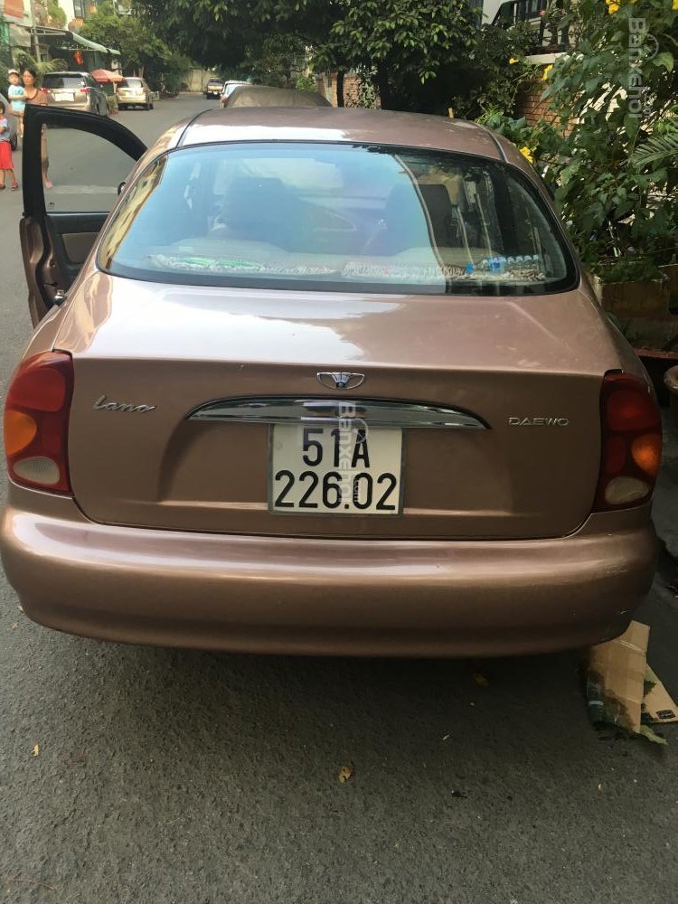 Daewoo Lanos 2002 - Bán rất gấp em Lanos đời 2002, màu nâu