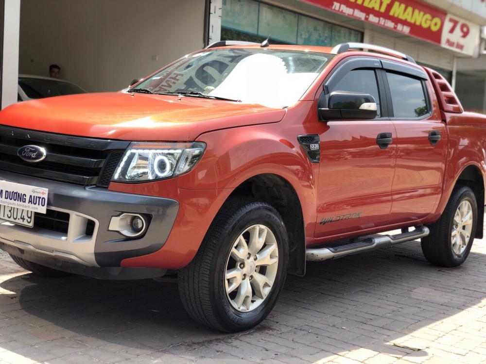 Ford Ranger Wildtrak 2.2AT 2014 - Bán xe Ford Ranger Wildtrak 2.2AT đời 2014 màu cam, giá tốt, nhập khẩu nguyên chiếc