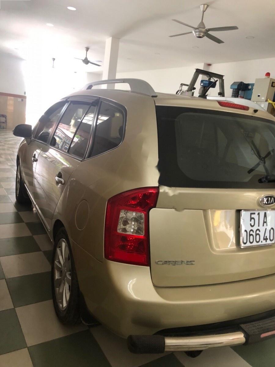 Kia Carens SXAT 2011 - Cần bán lại xe Kia Carens SXAT sản xuất 2011, màu vàng, 360tr