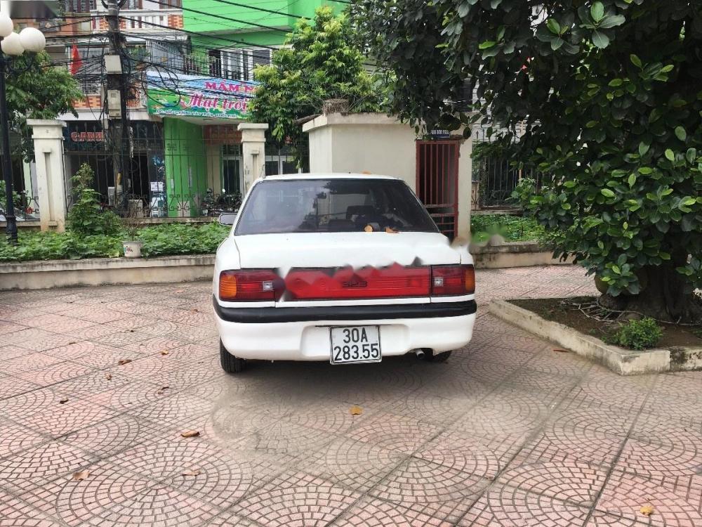 Mazda 323 1.6 MT 1996 - Cần bán Mazda 323 1.6 MT năm 1996, màu trắng giá cạnh tranh