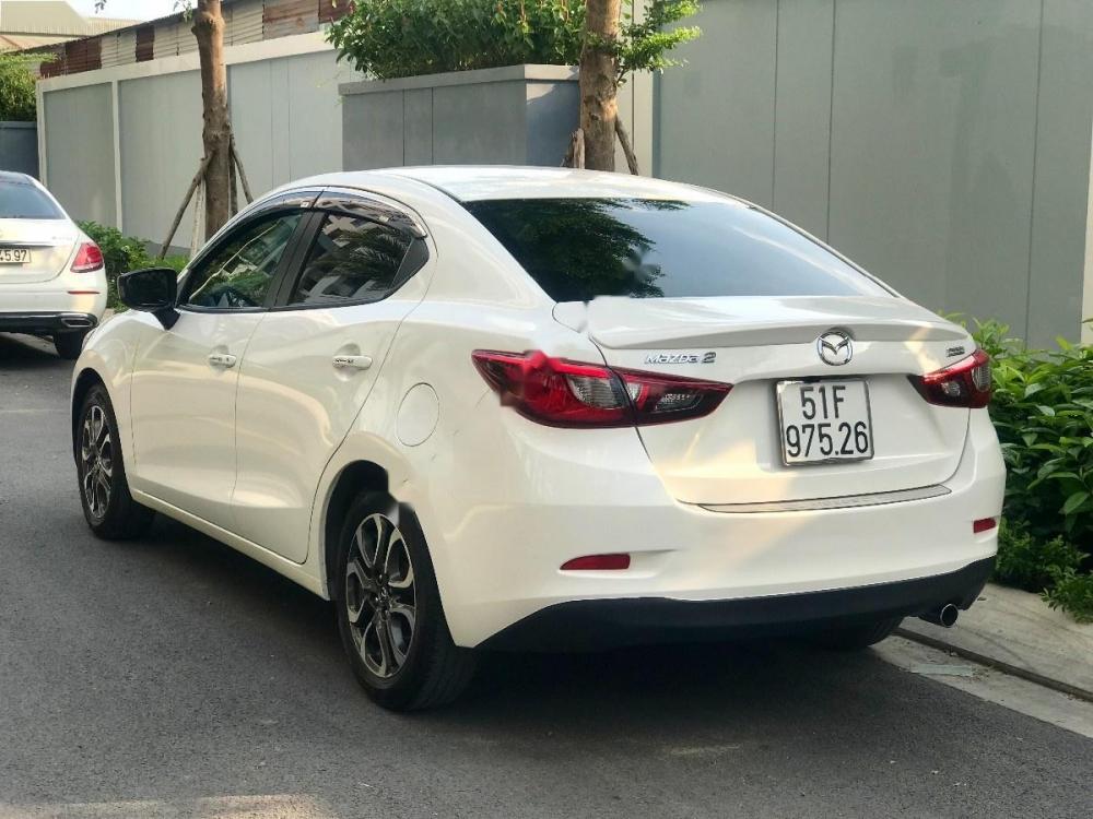 Mazda 2 2016 - Bán xe Mazda 2 2016, màu trắng còn mới