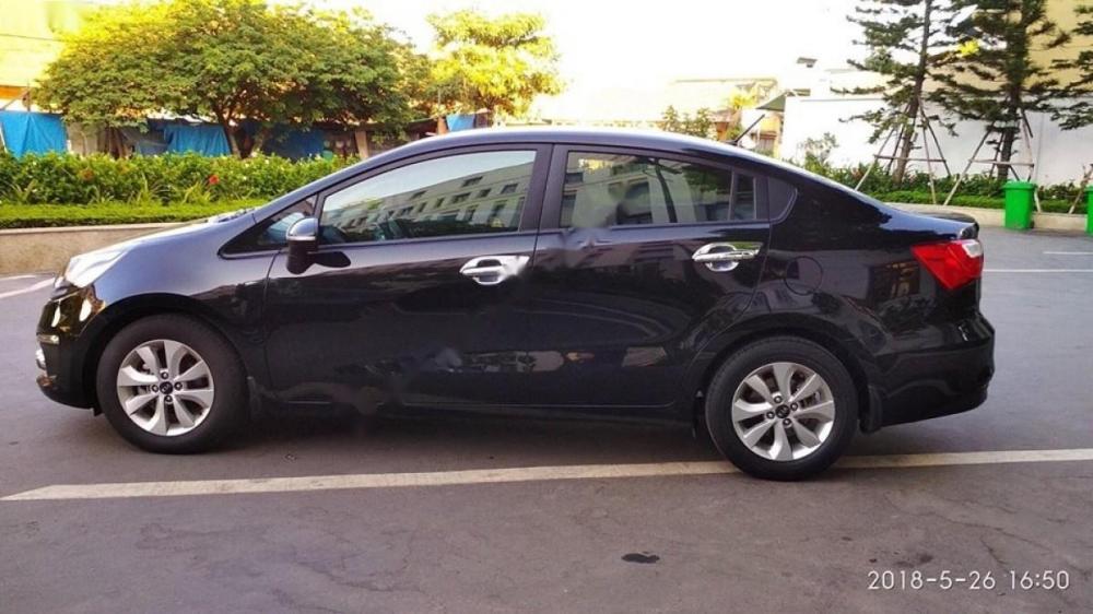 Kia Rio 1.4 AT 2015 - Bán Kia Rio 1.4 AT 2015, màu đen, xe nhập chính chủ