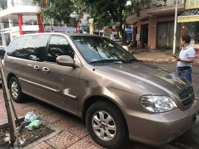 Kia Carnival 2009 - Cần bán lại xe Kia Carnival 2009, màu nâu