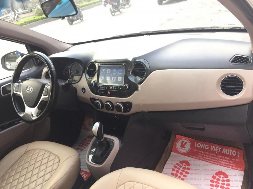 Hyundai Grand i10 1.0AT 2015 - Cần bán xe Hyundai Grand i10 1.0AT đời 2015, màu trắng