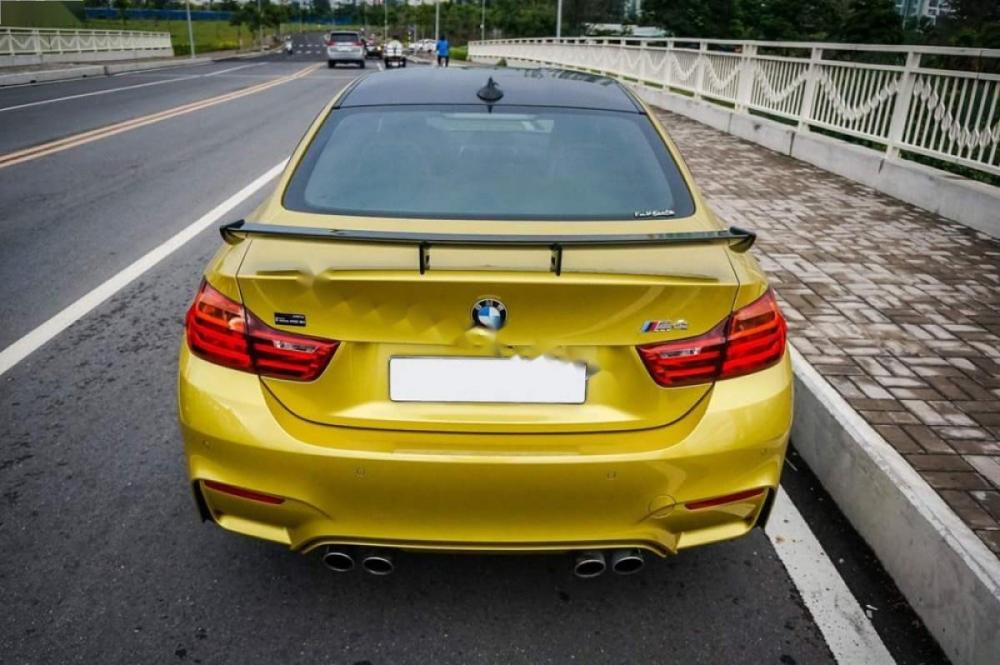 BMW M4 2016 - Cần bán lại xe BMW M4 sản xuất 2016, màu vàng, xe nhập