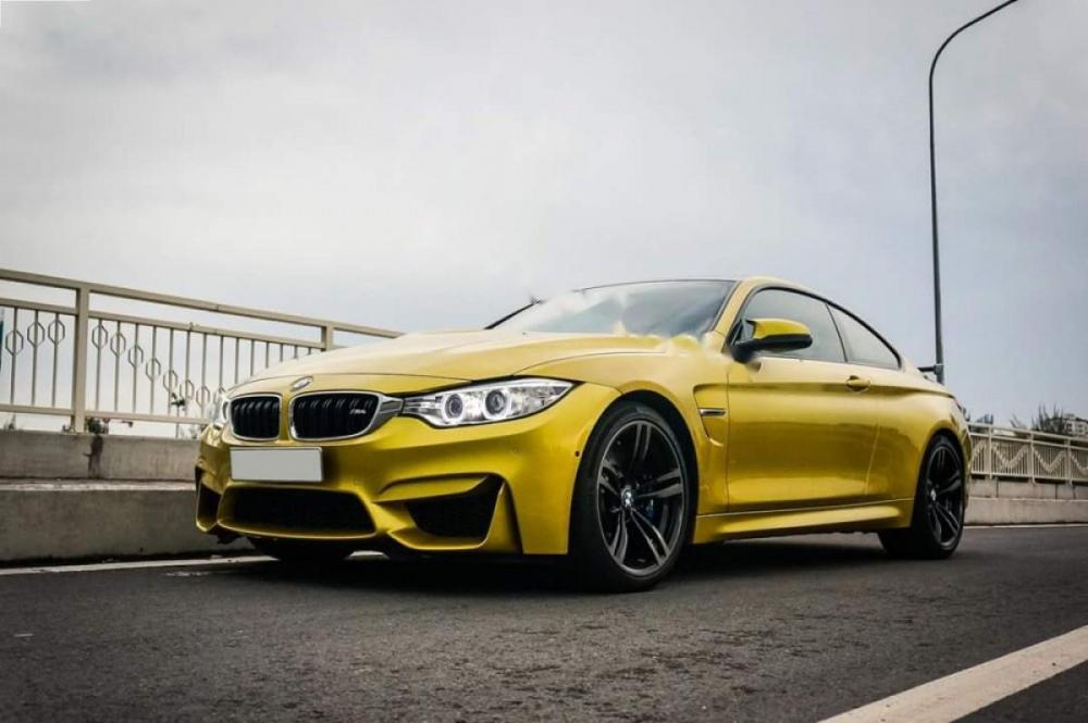 BMW M4 2016 - Cần bán lại xe BMW M4 sản xuất 2016, màu vàng, xe nhập