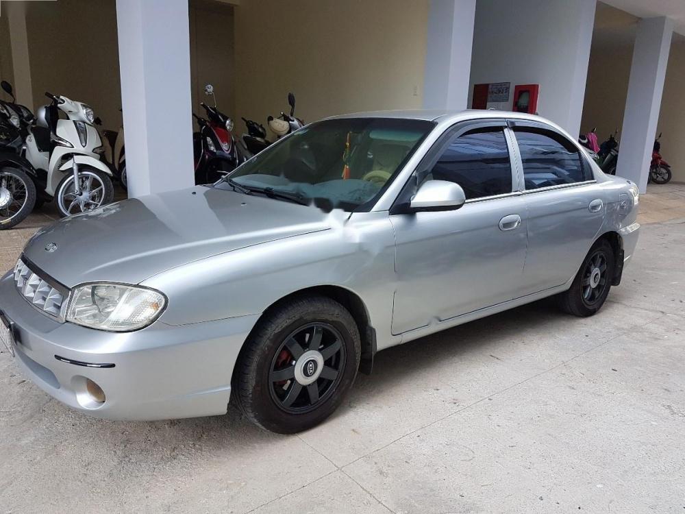 Kia Spectra 1.6 MT 2004 - Cần bán Kia Spectra 1.6 MT đời 2004, màu bạc, giá chỉ 135 triệu