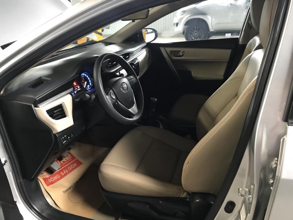 Toyota Corolla altis 1.8G MT 2015 - Cần bán xe Toyota Corolla altis 1.8G MT đời 2015, màu bạc