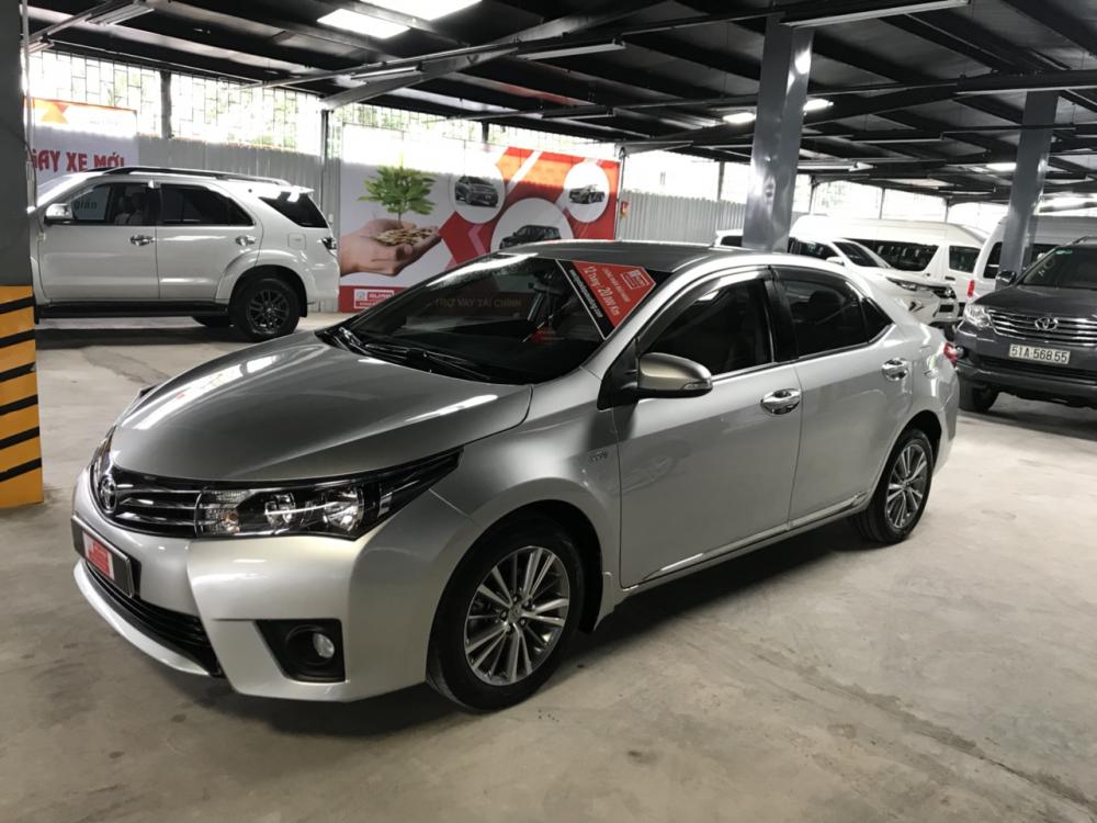 Toyota Corolla altis 1.8G MT 2015 - Cần bán xe Toyota Corolla altis 1.8G MT đời 2015, màu bạc