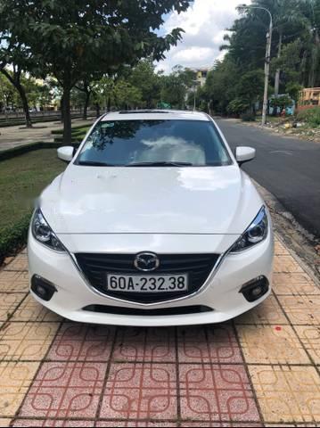 Mazda 3  1.5AT 2015 - Cần bán xe Mazda 3 1.5AT sản xuất năm 2015, màu trắng, giá chỉ 595 triệu