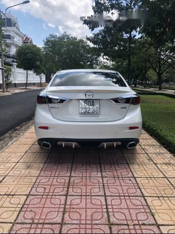 Mazda 3  1.5AT 2015 - Cần bán xe Mazda 3 1.5AT sản xuất năm 2015, màu trắng, giá chỉ 595 triệu