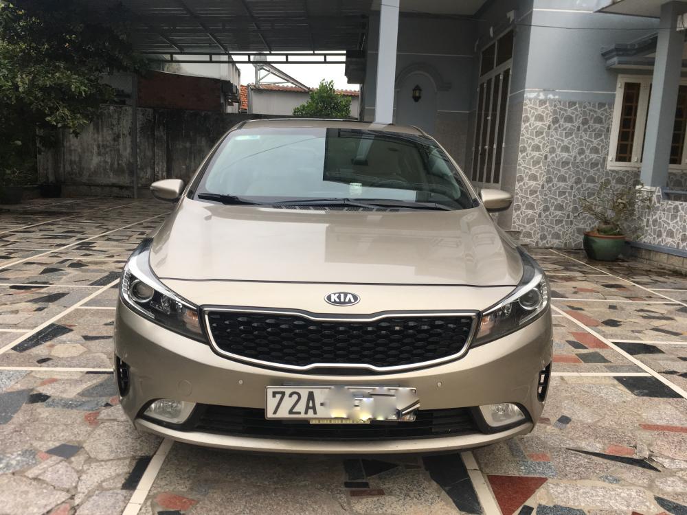 Kia Cerato AT 2016 - Cần bán Kia Cerato AT sản xuất 2016, màu nâu 