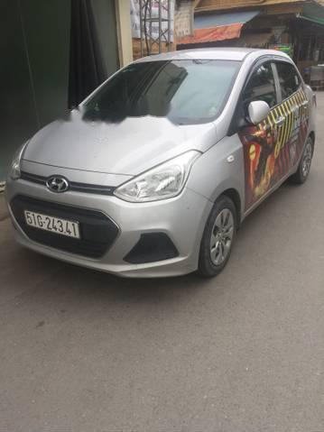 Hyundai Grand i10 2016 - Cần bán gấp Hyundai Grand i10 sản xuất năm 2016, màu bạc giá cạnh tranh