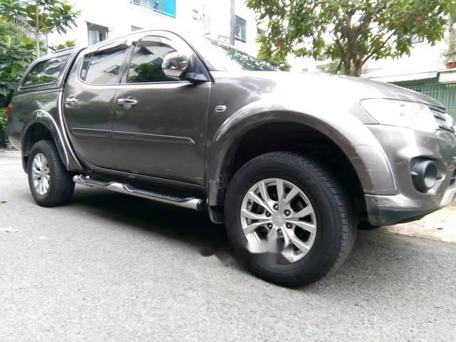 Mitsubishi Triton MT 2014 - Cần bán lại xe Mitsubishi Triton MT sản xuất năm 2014, màu nâu