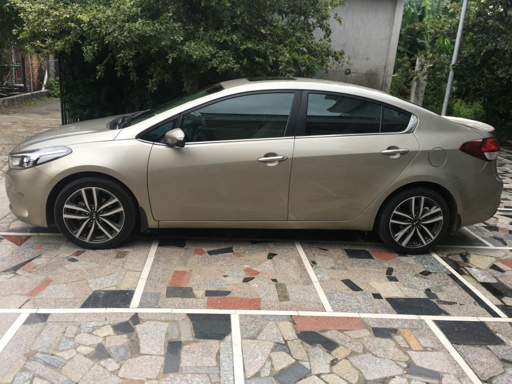 Kia Cerato AT 2016 - Cần bán Kia Cerato AT sản xuất 2016, màu nâu 