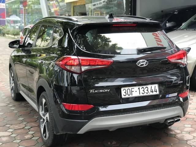 Hyundai Tucson 1.6 Turbo  2016 - Bán Hyundai Tucson 1.6 Turbo năm 2016, màu đen, giá 940tr