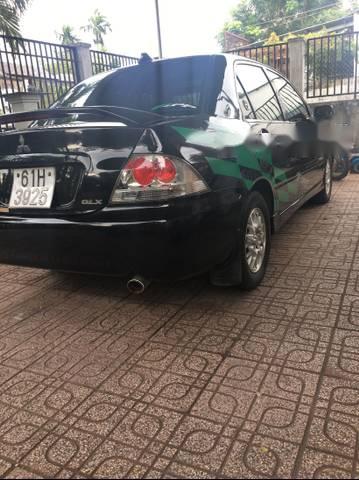 Mitsubishi Lancer   2003 - Cần bán gấp Mitsubishi Lancer năm sản xuất 2003, màu đen số tự động, giá tốt