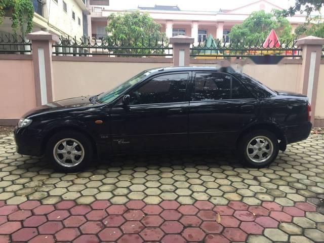 Mazda 323 2004 - Cần bán xe Mazda 323 2004, màu đen xe gia đình, 190tr