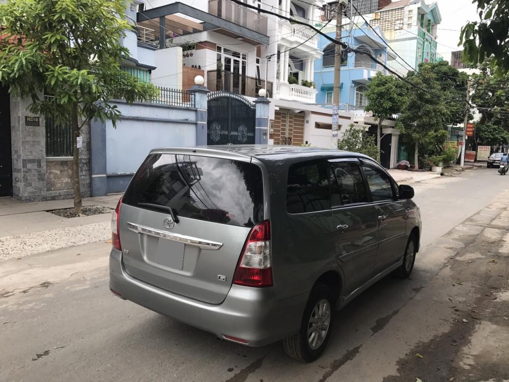 Toyota Innova G 2014 - Mình bán Toyota Innova G 2014 số tự động, màu bạc xe đẹp zin nguyên