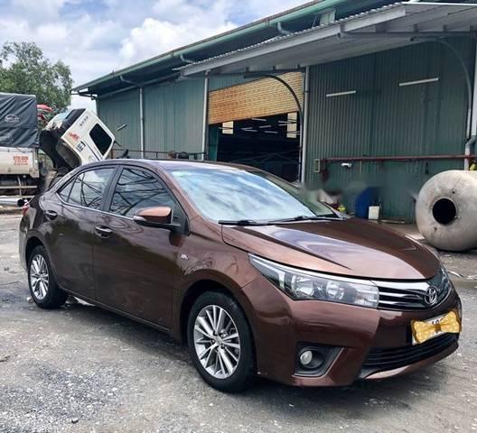 Toyota Corolla altis   2015 - Bán Toyota Corolla altis năm sản xuất 2015, màu nâu như mới, 665 triệu