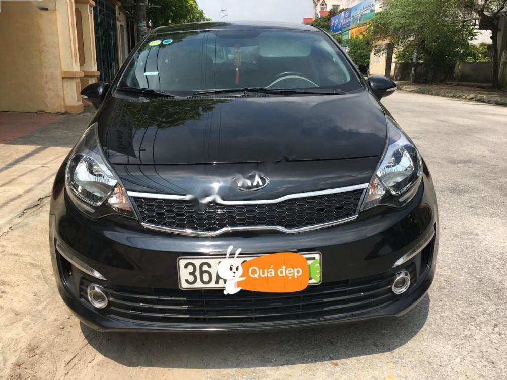 Kia Rio 1.4 AT 2016 - Cần bán xe Kia Rio 1.4 AT sản xuất 2016, màu đen, nhập khẩu  