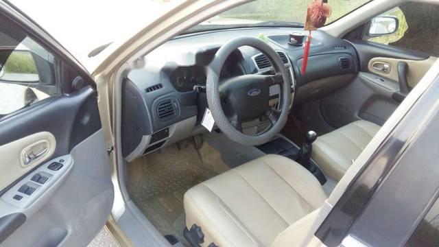 Ford Laser  1.8MT 2003 - Cần bán Ford Laser 1.8MT năm 2003, màu vàng chính chủ giá cạnh tranh