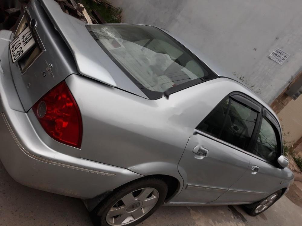 Ford Laser GHIA 1.8 MT 2003 - Cần bán lại xe Ford Laser GHIA 1.8 MT 2003, màu bạc 