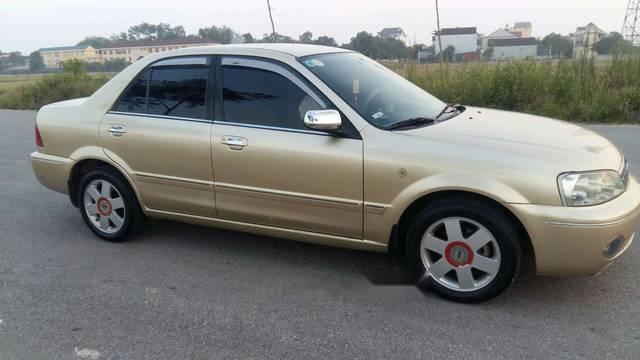 Ford Laser  1.8MT 2003 - Cần bán Ford Laser 1.8MT năm 2003, màu vàng chính chủ giá cạnh tranh