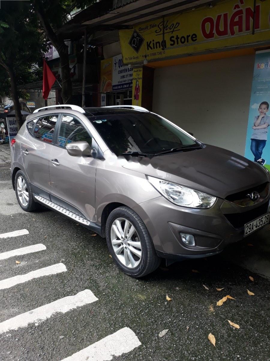 Hyundai Tucson 2.0 AT 4WD 2011 - Cần bán Hyundai Tucson 2.0 AT 4WD năm 2011, màu xám, xe nhập  