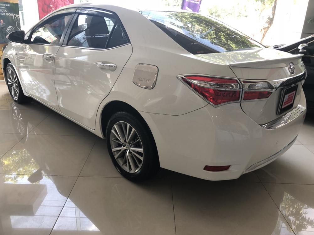 Toyota Corolla altis G 2015 - Bán ô tô Toyota Corolla Altis G sản xuất năm 2015, màu trắng, giá tốt