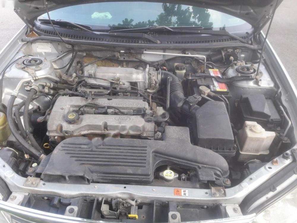 Ford Laser LXi 1.6 MT 2004 - Cần bán gấp Ford Laser LXi 1.6 MT 2004, màu bạc như mới