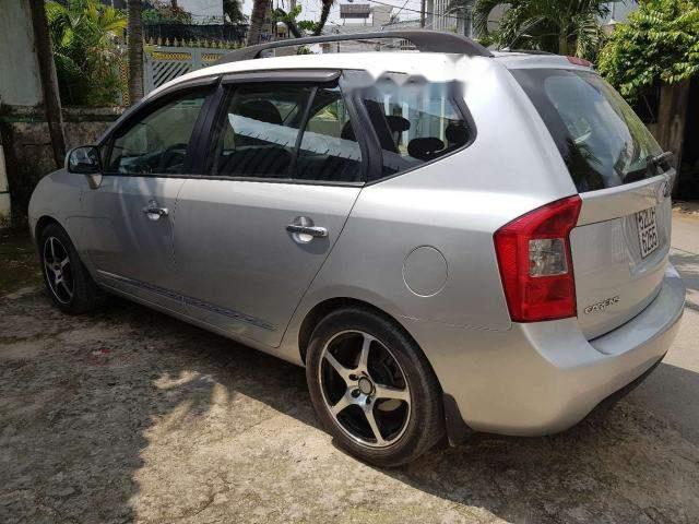 Kia Carens 2010 - Gia đình bán Kia Carens SX 2010, màu bạc số tự động