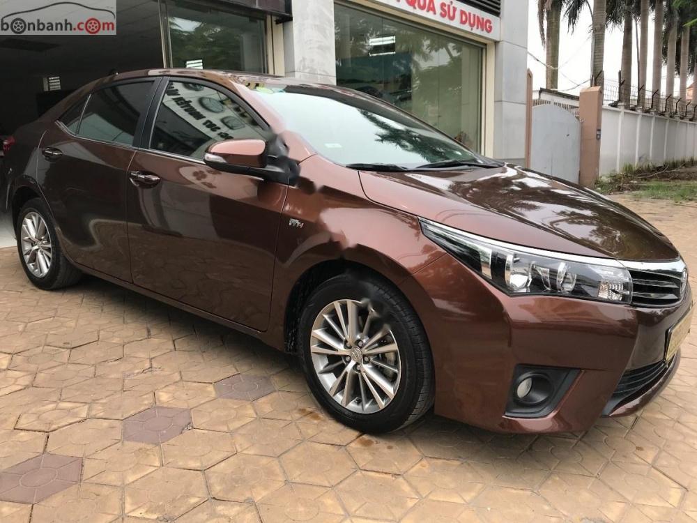 Toyota Corolla altis 1.8G   2015 - Cần bán xe Toyota Corolla altis 1.8G sản xuất năm 2015, màu nâu còn mới giá cạnh tranh