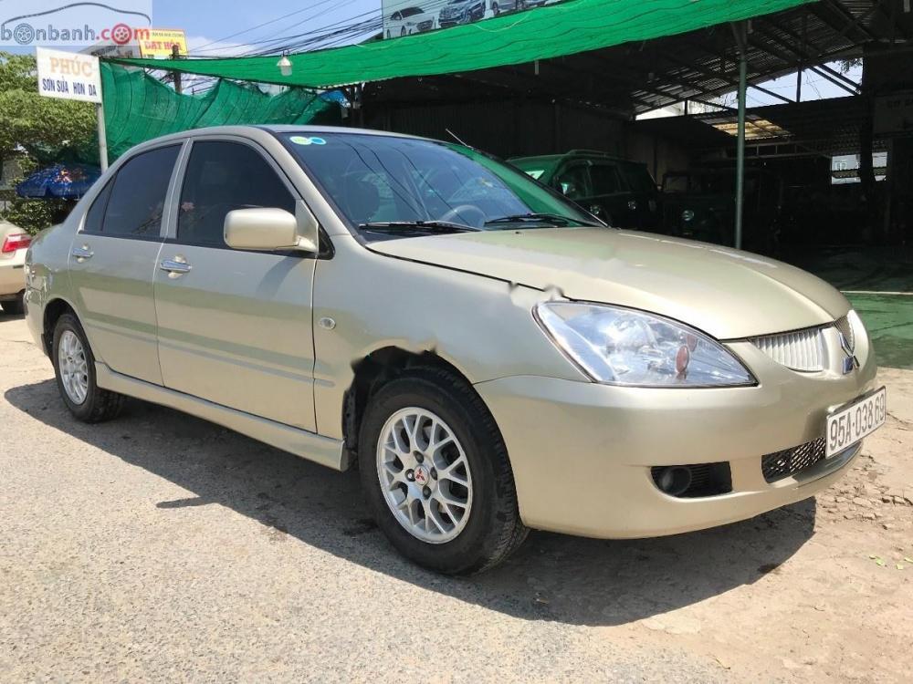 Mitsubishi Galant 1.5 2003 - Bán lại xe Mitsubishi Galant 1.5 2003, màu vàng cát