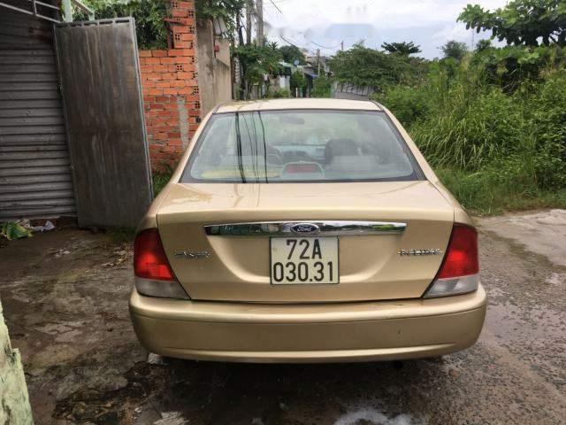 Ford Laser   Deluxe  2001 - Cần bán lại xe Ford Laser Deluxe năm 2001, màu vàng cát