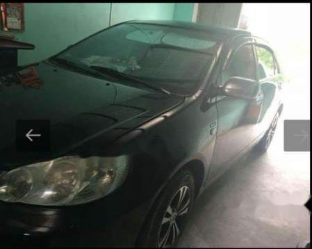 Toyota Corolla 2004 - Cần bán xe Toyota Corolla đời 2004, màu đen còn mới