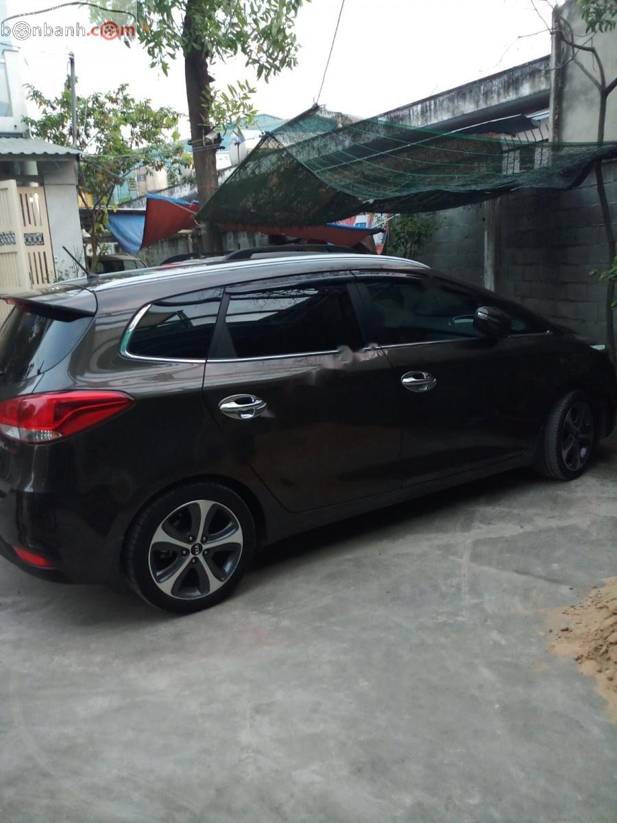 Kia Rondo AT 2015 - Bán xe Kia Rondo At sản xuất 2015, màu nâu, xe đẹp một đời chủ còn cực mới