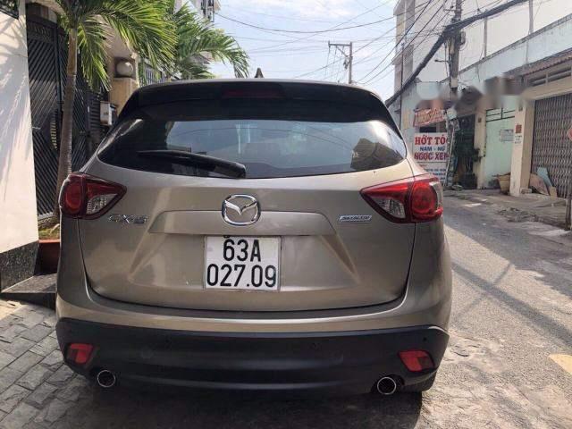 Mazda CX 5 2.0 2014 - Cần bán xe Mazda CX 5 2.0 đời 2014, màu nâu ít sử dụng