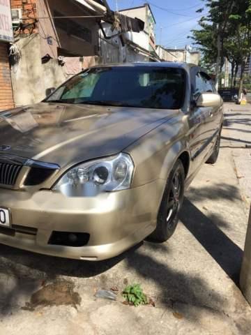 Daewoo Magnus 2.0MT 2004 - Bán Daewoo Magnus 2.0MT đời 2004, màu vàng, 165 triệu