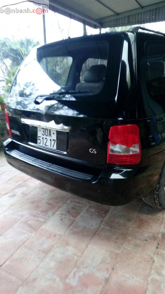 Kia Carnival GS 2.5 MT 2006 - Bán Kia Carnival GS 2.5 MT sản xuất 2006, màu đen, xe gia đình