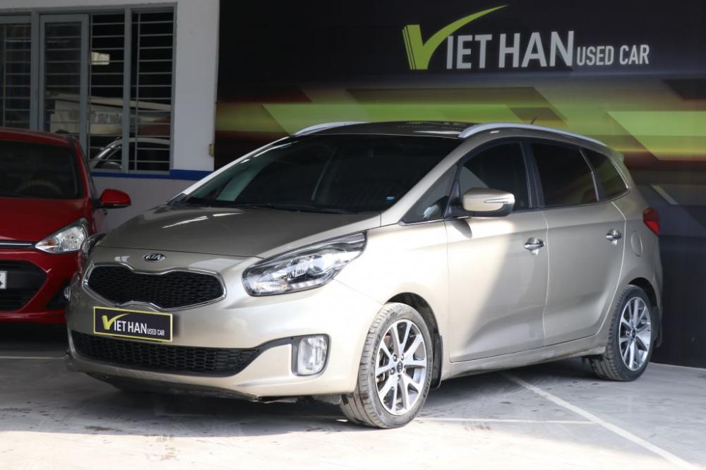 Kia Rondo 1.7MT 2015 - Bán xe Kia Rondo 1.7MT 2015, màu vàng, giá chỉ 548 triệu