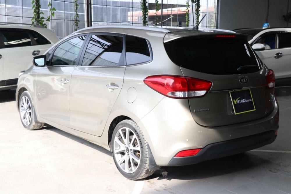 Kia Rondo 1.7MT 2015 - Bán xe Kia Rondo 1.7MT 2015, màu vàng, giá chỉ 548 triệu