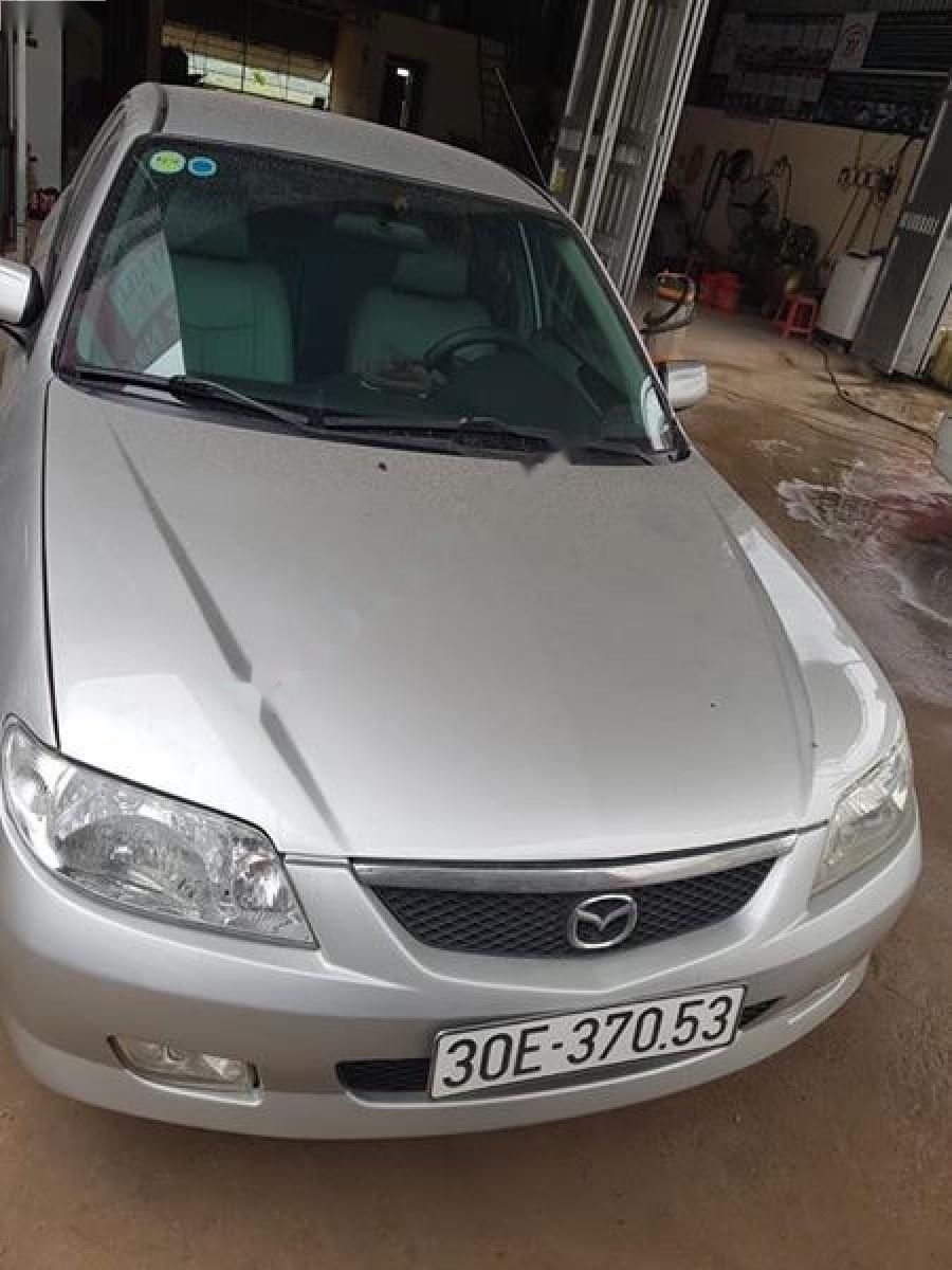 Mazda 323 2004 - Bán ô tô Mazda 323 2004, màu bạc như mới