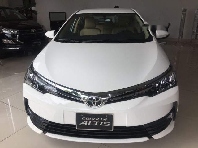 Toyota Corolla altis  1.8E   2018 - Bán ô tô Toyota Corolla altis 1.8E đời 2018, màu trắng, 718tr