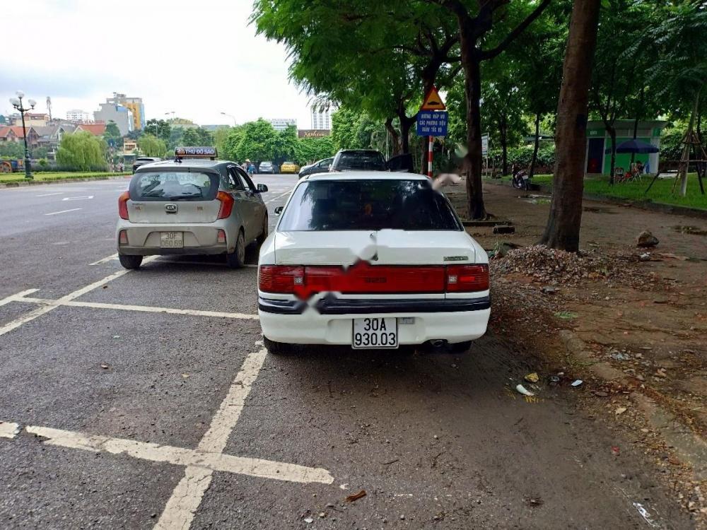 Mazda 323 1.6 MT 1995 - Bán Mazda 323 1.6 MT đời 1995, màu trắng, xe nhập