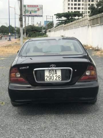 Daewoo Magnus  2.4AT 2004 - Bán Daewoo Magnus 2.4AT năm sản xuất 2004, màu đen, xe nhập, số tự động 