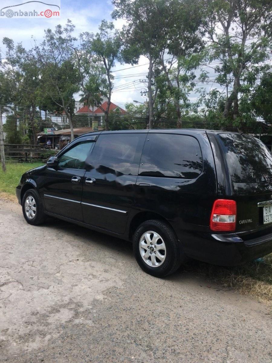 Kia Carnival GS 2006 - Bán Kia Carnival GS năm 2006, màu đen