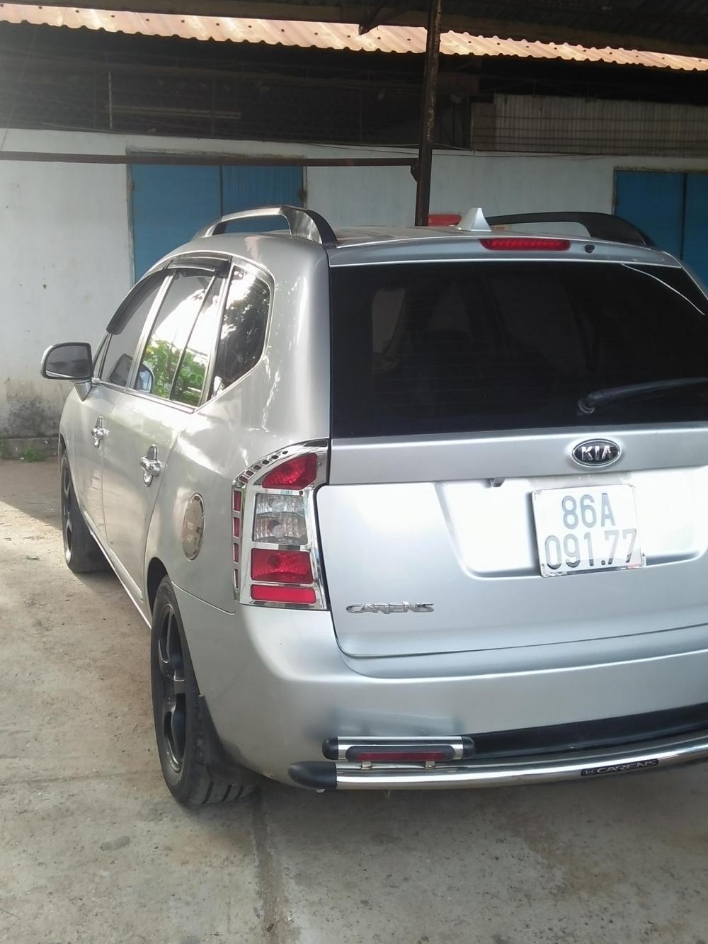 Kia Carens Lx 2010 - Bán Kia Carens Lx đời 2010, màu bạc đã đi 90300km, giá 295tr