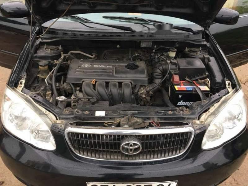 Toyota Corolla altis 1.8G MT 2003 - Bán Toyota Corolla altis 1.8G MT đời 2003, màu đen số sàn, giá chỉ 243 triệu