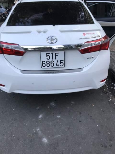 Toyota Corolla   2016 - Bán xe Toyota Corolla năm 2016, màu trắng như mới, giá 650tr